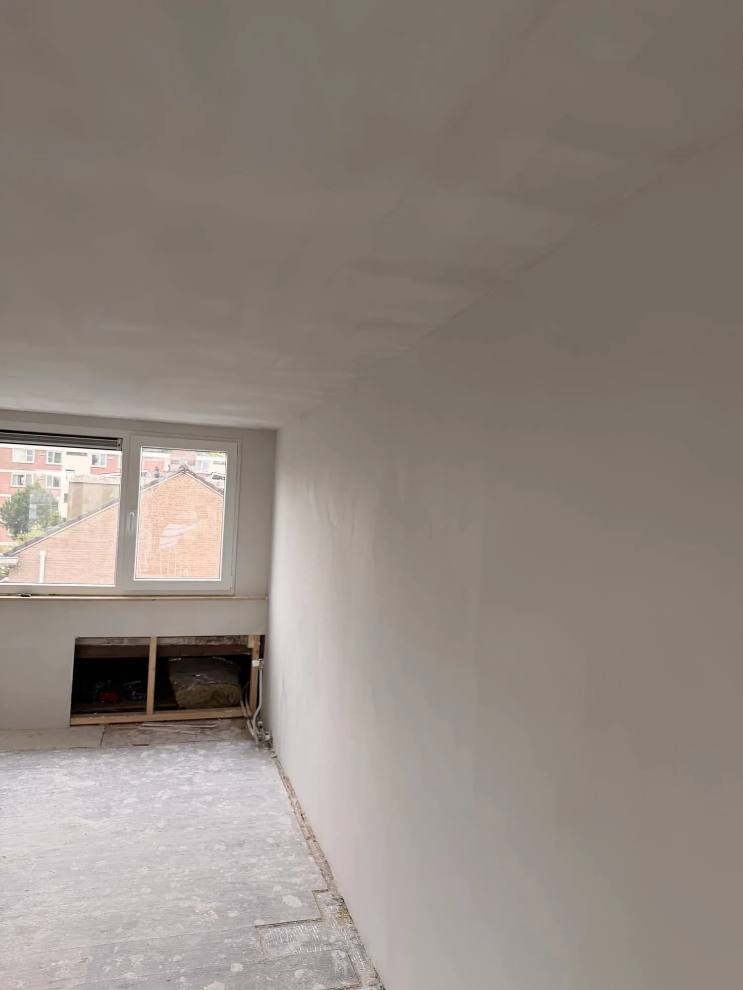 Attic room smoothly plastered, ready to paint